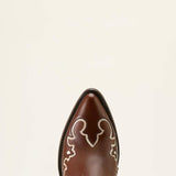 Brown cowboy boot with decorative white patterns on a beige background